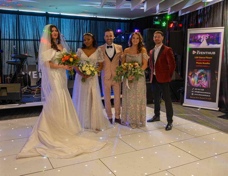 Bridal party posing on the Wedfest dance floor